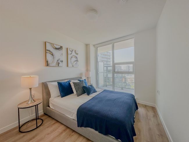 Bedroom featuring light wood-style floors and baseboards | Image 10