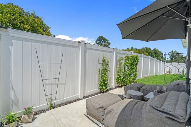 Fenced backyard featuring a patio | Image 33
