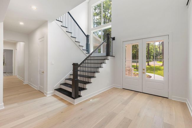 Beautiful light and bright entry showcases real wood flooring that flows throughout the downstairs. | Image 4
