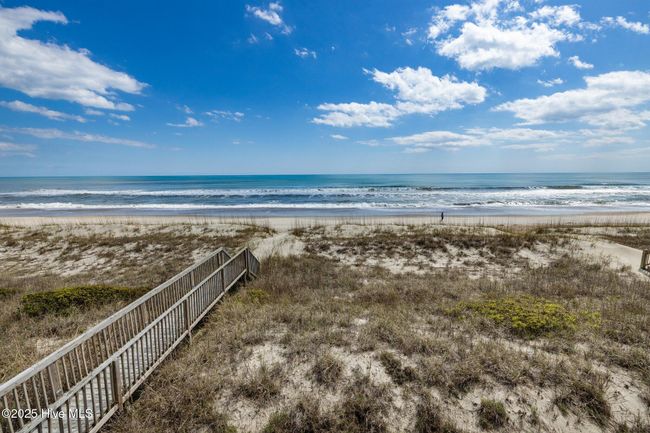 Walkway leading from the deck to the beach and ocean | Image 8