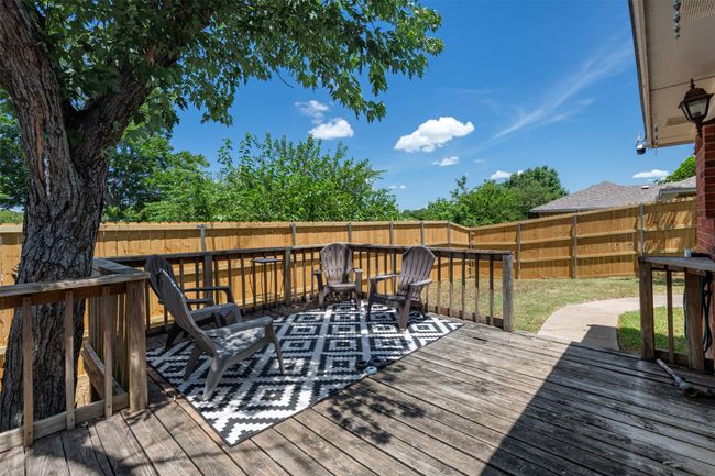 Wooden deck featuring a fenced backyard | Image 22