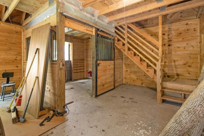 Main level with stall, workbench, and storage | Image 33