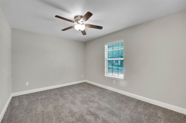Unfurnished room with baseboards, a ceiling fan, and carpet | Image 27