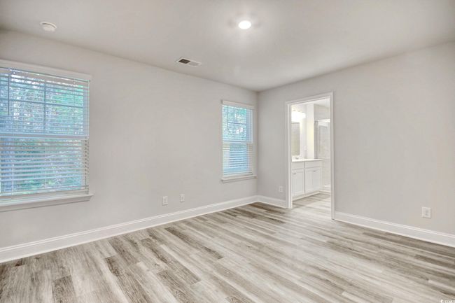 Unfurnished room featuring plenty of natural light and light hardwood / wood-style flooring | Image 23