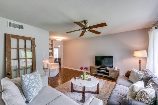 Living room featuring hardwood floors and ceiling fan | Image 6