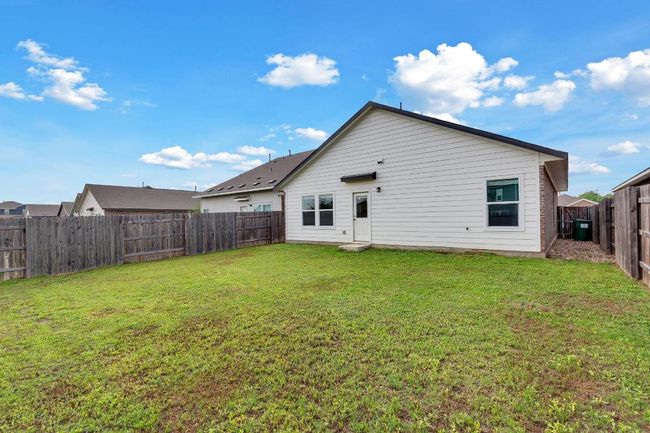 Back of property with a fenced backyard and a lawn | Image 21