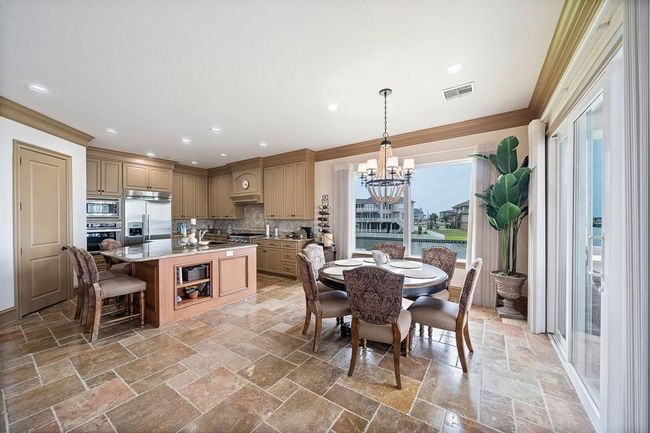 Spacious kitchen with breakfast bar & dining area | Image 9