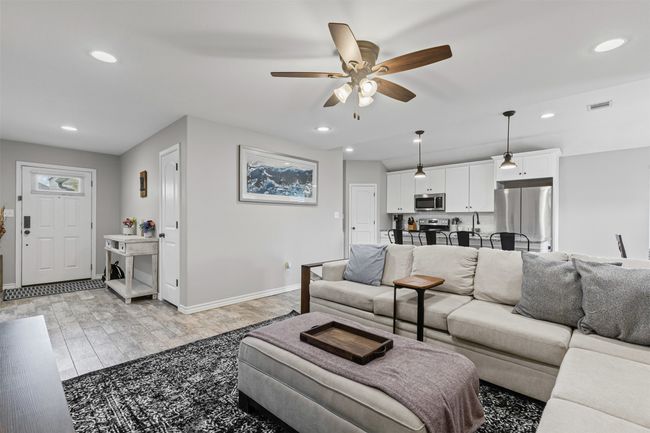 Living room featuring ceiling fan, recessed lighting, baseboards, and light wood-type flooring | Image 10