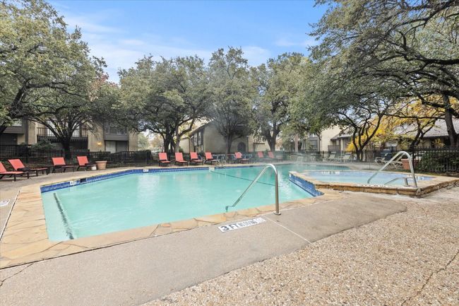 Community pool with a patio | Image 17