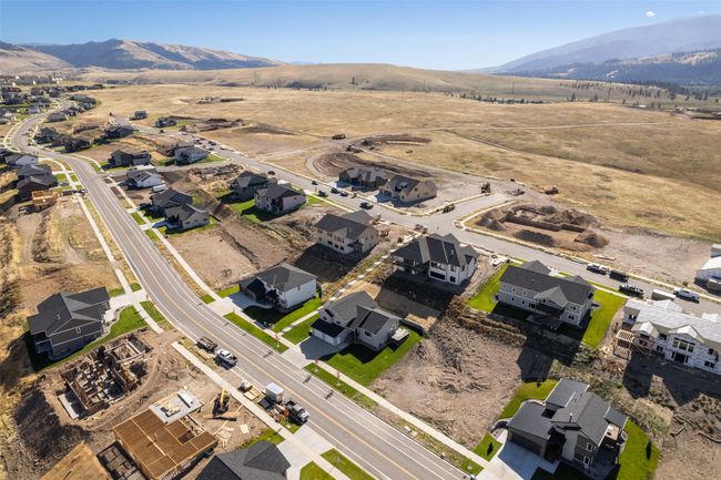 Aerial view of property and surrounding area with a mountain backdrop and nearby suburban area | Image 55