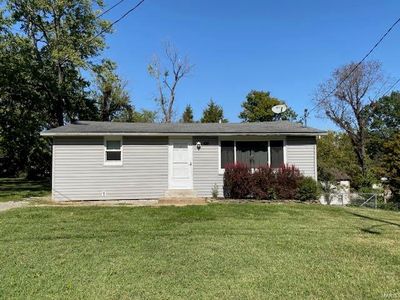 View of front of property featuring a front lawn | Image 1