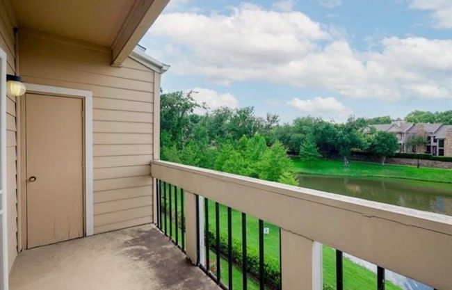 Balcony featuring a water view | Image 25
