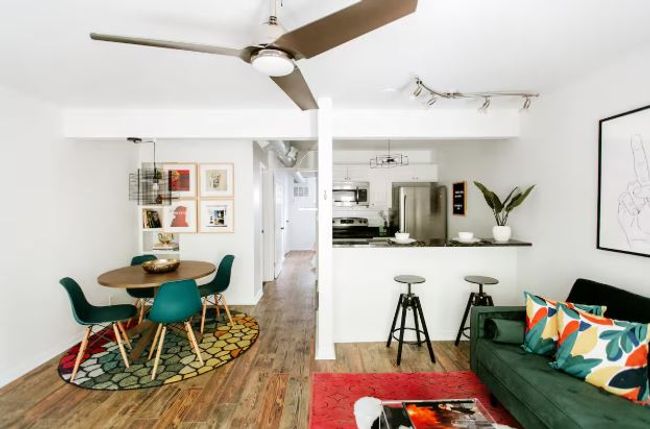 Living room featuring wood finished floors and track lighting | Image 11
