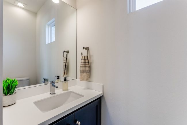 Bathroom with toilet and vanity | Image 12