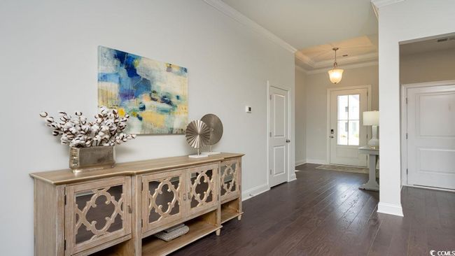 Hall with baseboards, ornamental molding, and dark wood-style floors | Image 4