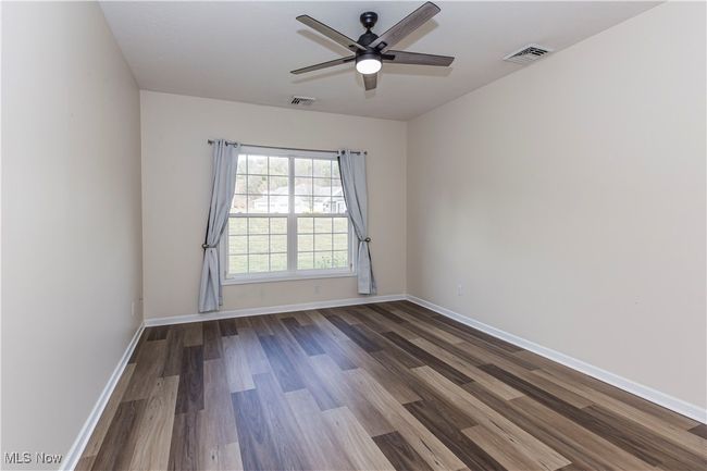 Bedroom featuring new flooring | Image 4