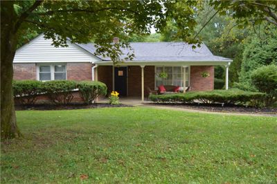 Ranch-style home featuring a front lawn | Image 1