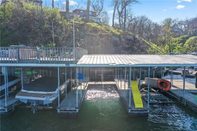 Dock area featuring a water view | Image 1