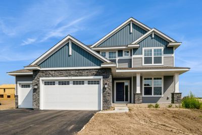 Photo is of the actual home. The Lewis floorplan has excellent curb appeal! | Image 1