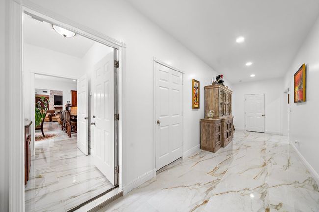 Wide hallway with polished floors and bright lighting | Image 17