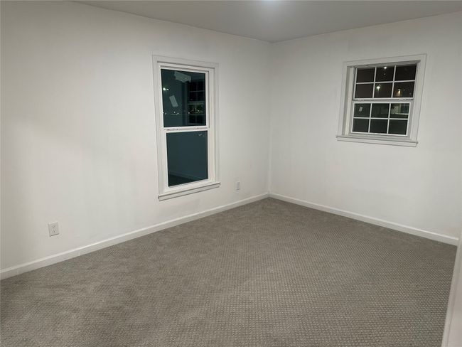 Empty room featuring carpet floors and baseboards | Image 28