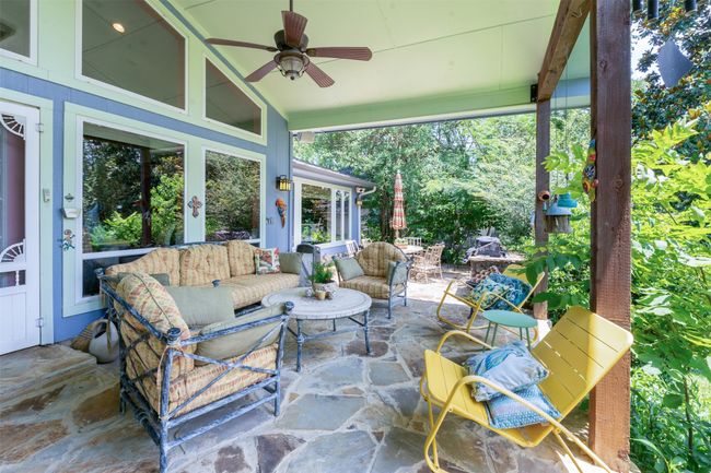 Covered Patio with Stone Deck is a favorite place to hang out | Image 31