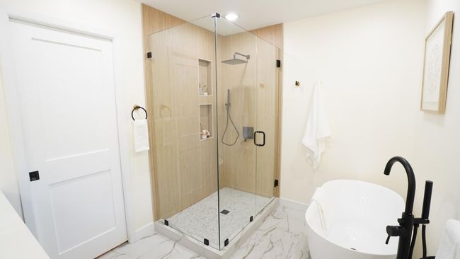 The show-stopping owners' shower is everything luxurious, from the large glass surround to the spa-like shower fixtures. | Image 12