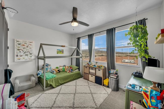 Carpeted bedroom with baseboards and a ceiling fan | Image 14