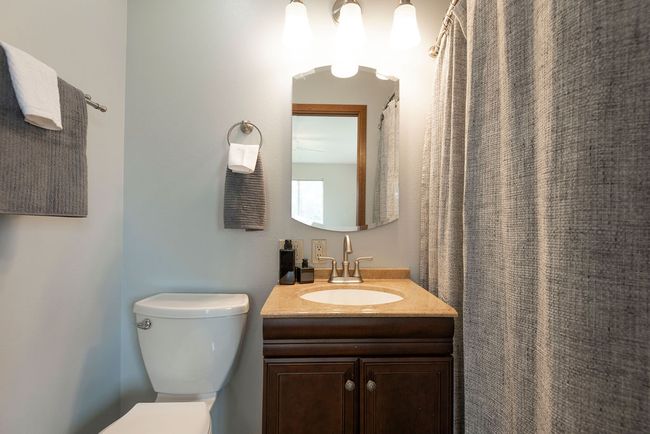 Full bath featuring toilet and vanity | Image 12