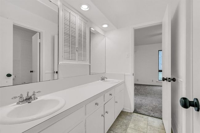 Bathroom featuring double vanity, recessed lighting, and baseboards | Image 19