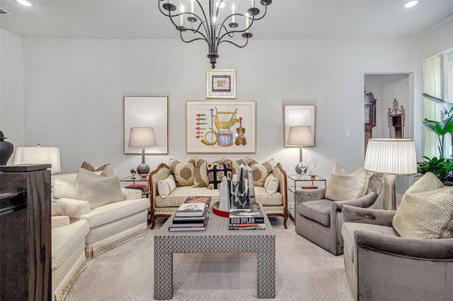 Living area with recessed lighting, a notable chandelier, light colored carpet, and visible vents | Image 21
