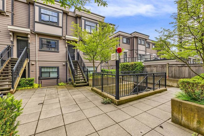 View of patio featuring stairway and a residential view | Image 23