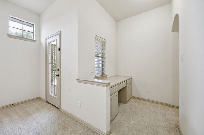 Entryway featuring light carpet and baseboards | Image 27