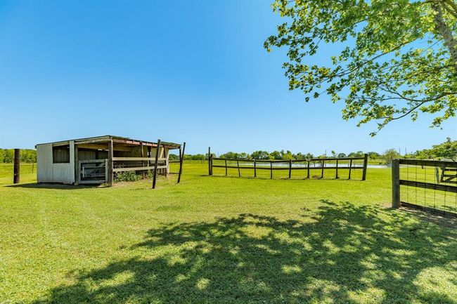 View of the Livestock Shed & Pen. This could also be converted into a Chicken Coop. Shed & Pen has not been used by current Owner, but it just needs some work & TLC. | Image 49