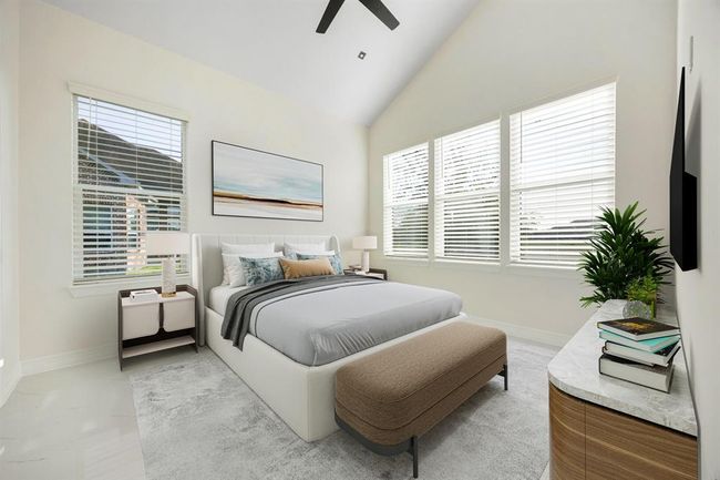 This spacious secondary bedroom is filled with natural light thanks to a wall of large windows, creating a warm and inviting atmosphere. Featuring high ceilings, neutral tones, and sleek modern finishes, it offers a serene retreat perfect for guests or family. An en suite bathroom adds an extra layer of comfort and privacy, making this space as functional as it is beautiful. | Image 27