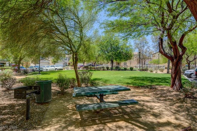 View of community featuring a lawn | Image 28