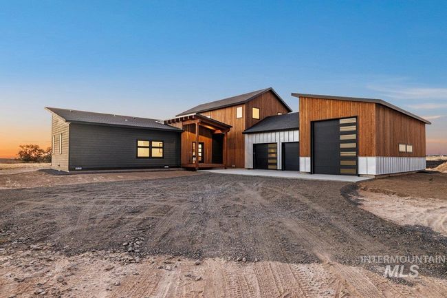 Modern home featuring driveway and an attached garage | Image 4
