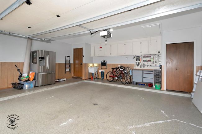 Epoxy coated floor. Cabinets for storage and a sto | Image 25