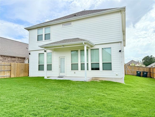 Back of property featuring a fenced backyard and a patio area | Image 39