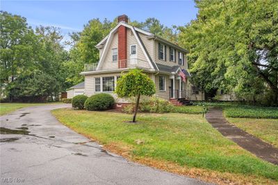 View of front of house featuring a balcony and a front lawn | Image 2