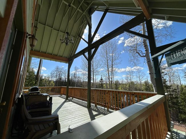 Wooden terrace with view of scattered trees | Image 11