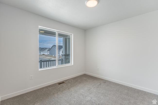 Spare room featuring carpet and baseboards | Image 13