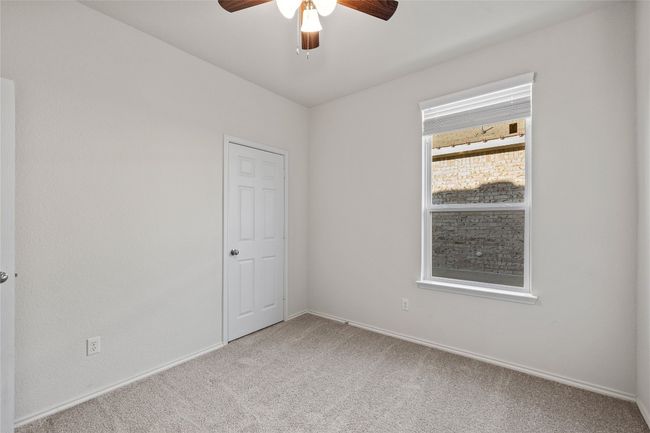 bedroom room with ceiling fan and carpet floors | Image 26