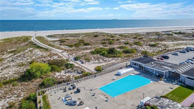 Birds eye view of property with a water view and a view of the beach | Image 20