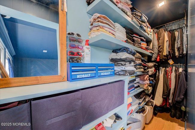 View behind the wall with TV and toys - Closet | Image 13