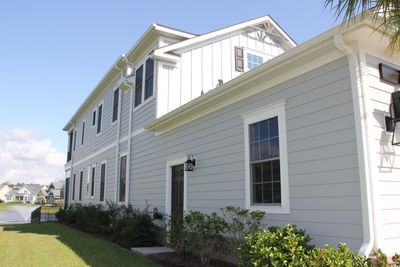 View of property exterior with a yard | Image 3