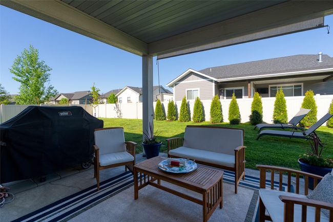 View of patio / terrace featuring outdoor lounge area, a grill, and a residential view | Image 30