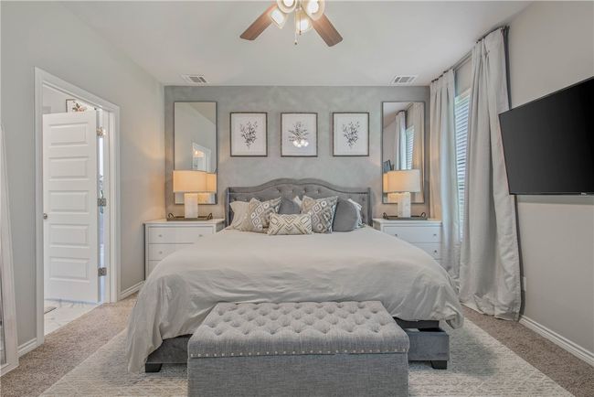 Carpeted bedroom with baseboards and a ceiling fan | Image 23