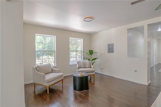 Sitting room featuring electric panel, ceiling fan, and dark hardwood / wood-style flooring | Image 18