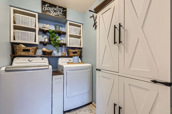 Laundry room with washing machine and dryer and cabinet space | Image 22